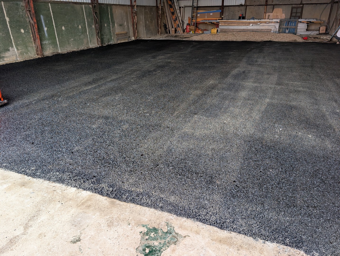 New tarmac surfacing laid inside an agricultural building