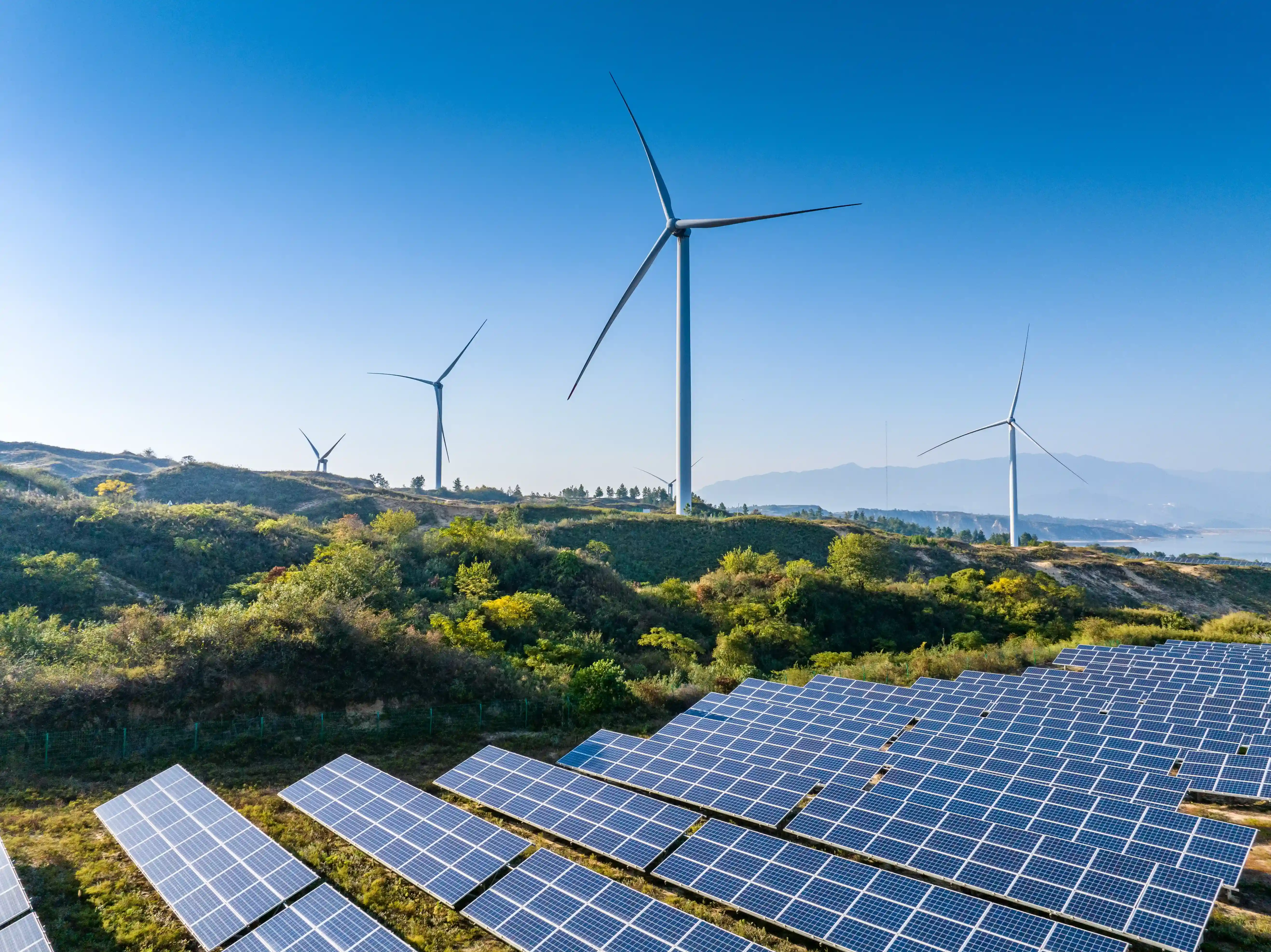 Solar panels in front of wind mills