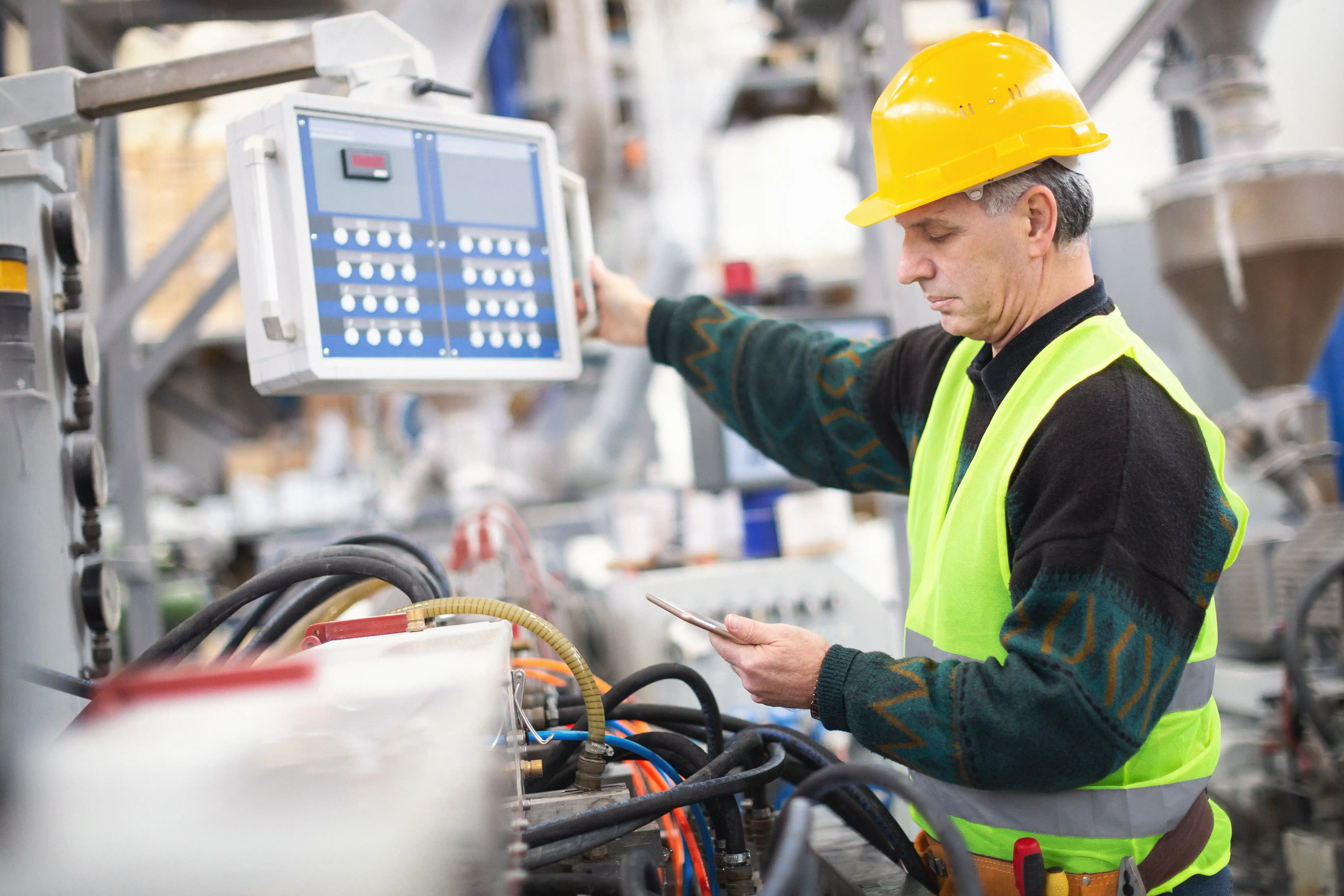 Worker stands in front of electrical switch box