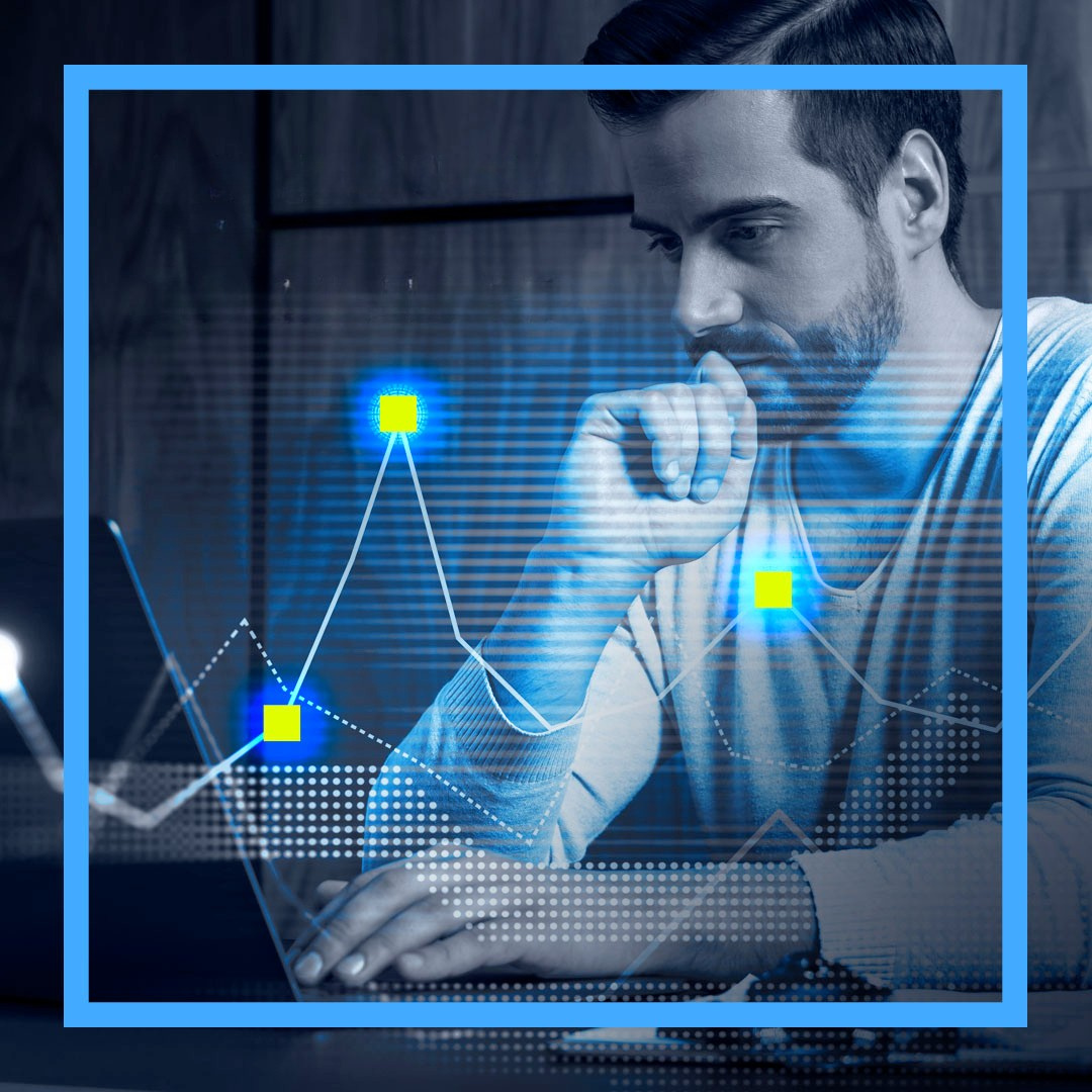 IT Manager checking stats on his laptop with AI overlay of graphs indicating being in control