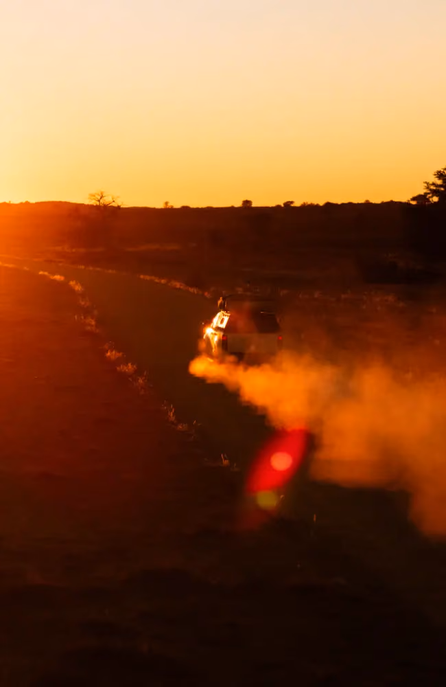 Khutse Game Reserve drive through tarmac and rugged off-road, Great Kalahari Botswana