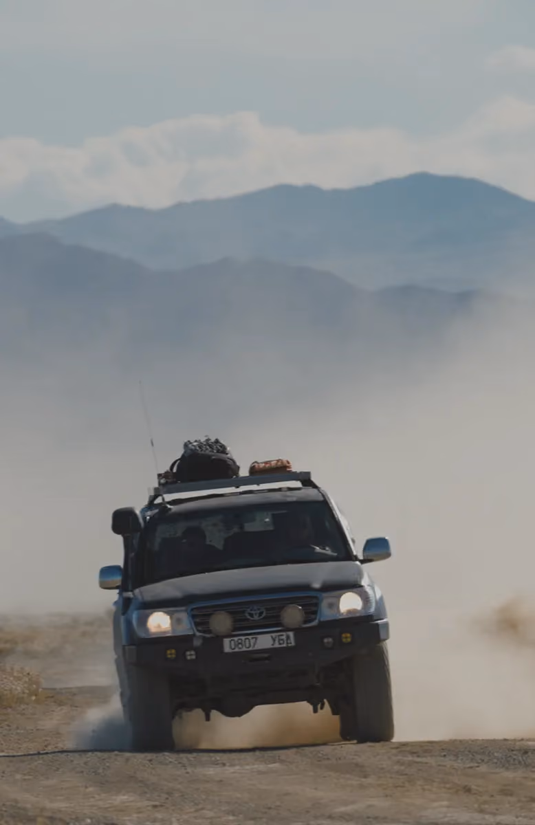 Altai mountains horizon and mining town stopover, Trans Gobi Desert Mongolia