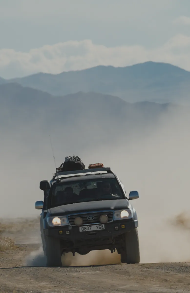 Altai mountains horizon and mining town stopover, Trans Gobi Desert Mongolia