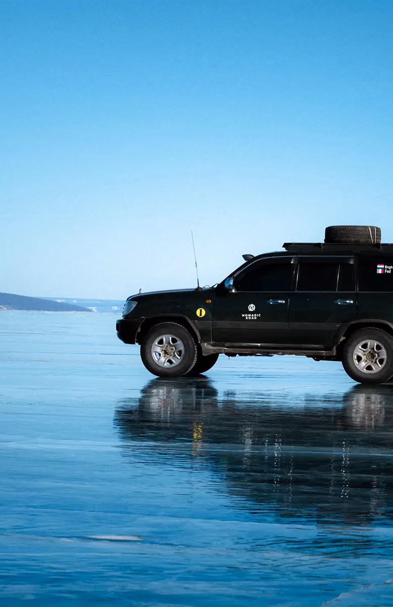 Driving on frozen Khuvsgul Lake in winter, Cold Steppes Mongolia