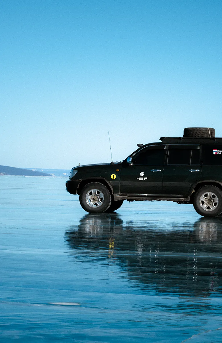 Driving on frozen Khuvsgul Lake in winter, Cold Steppes Mongolia