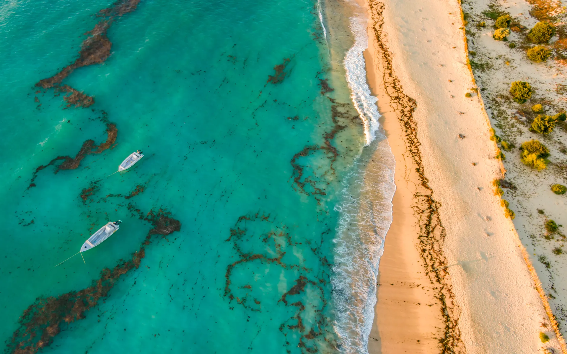 Aerial view of turquoise water, reef and a white beach on the Mozambique Channel, Madagascar