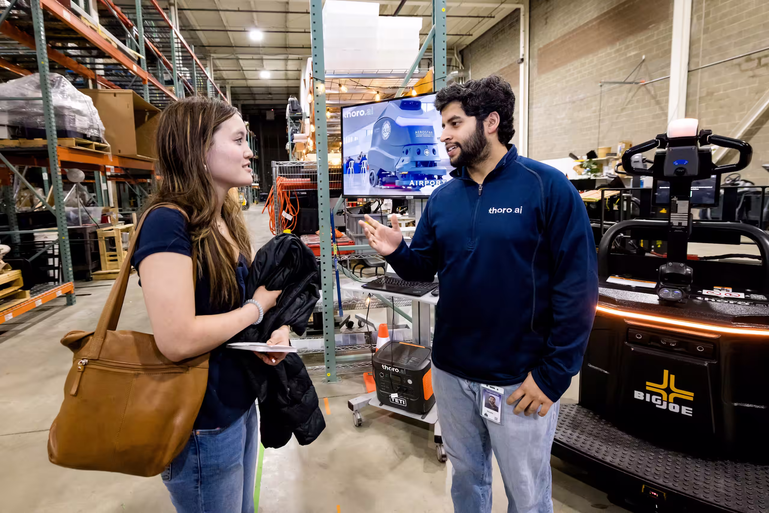 Early career robotics professional speaking with Thoro.ai representative
