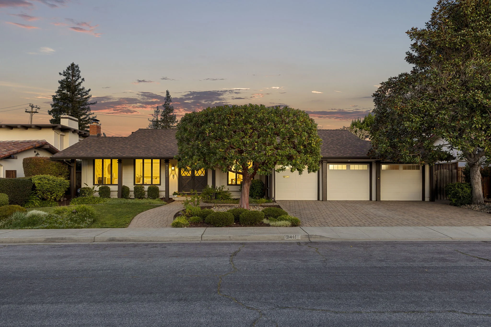 A beautiful single-family home in Cupertino, California beneath a twilight sky