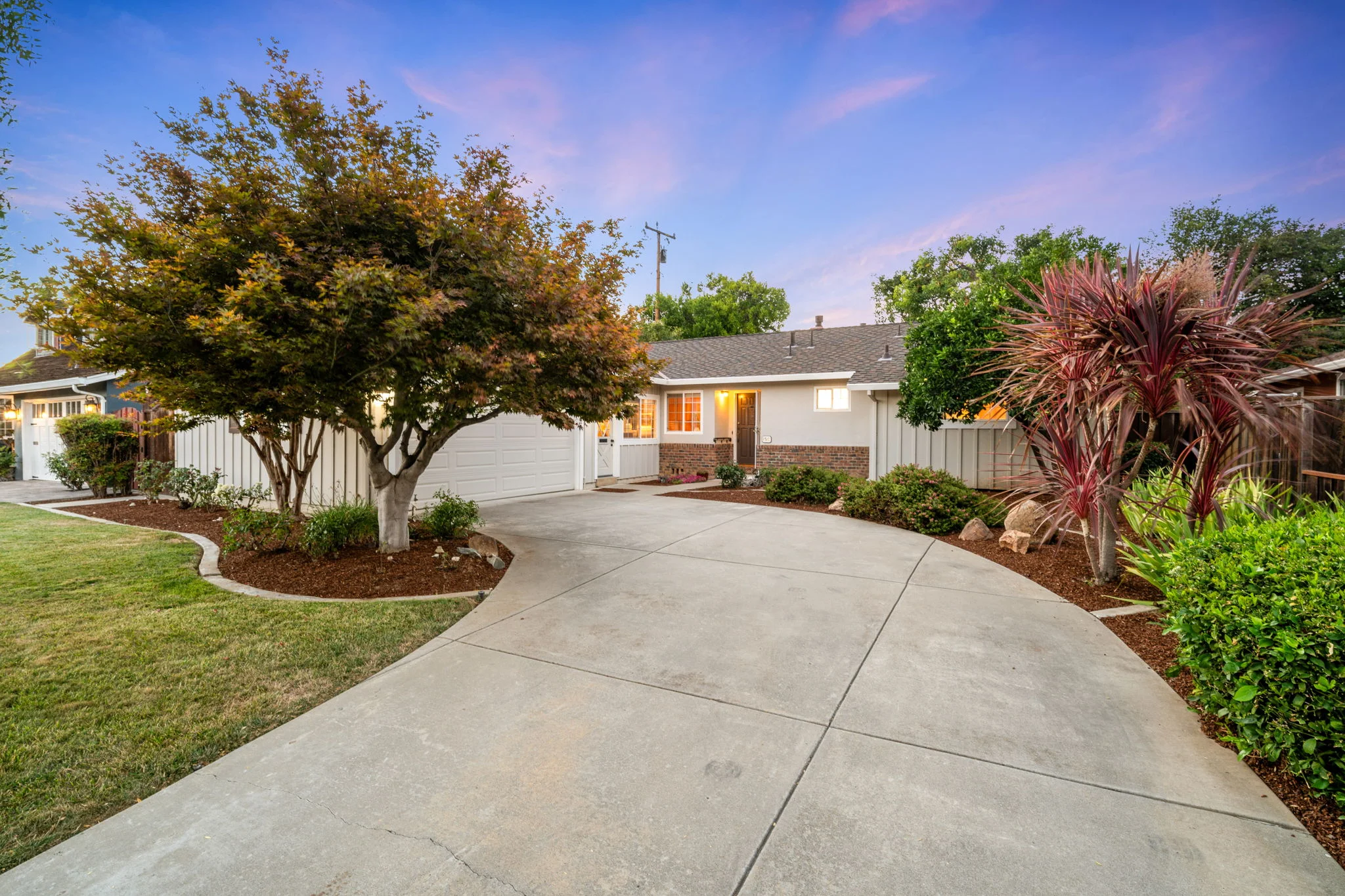 A charming single-family home with a green lawn in Campbell, California