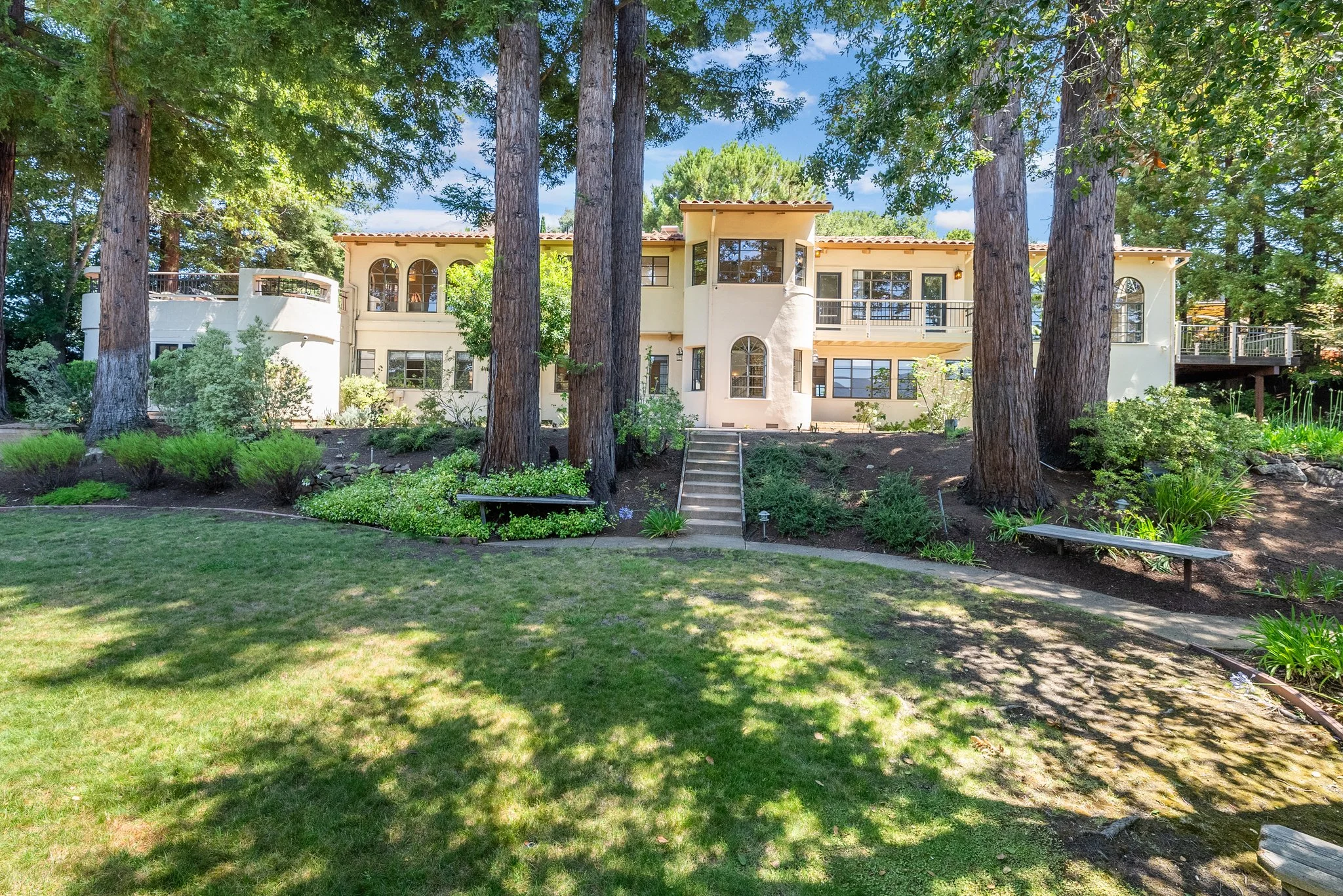 A classic two-story home on a tree-lined street in Palo Alto, California