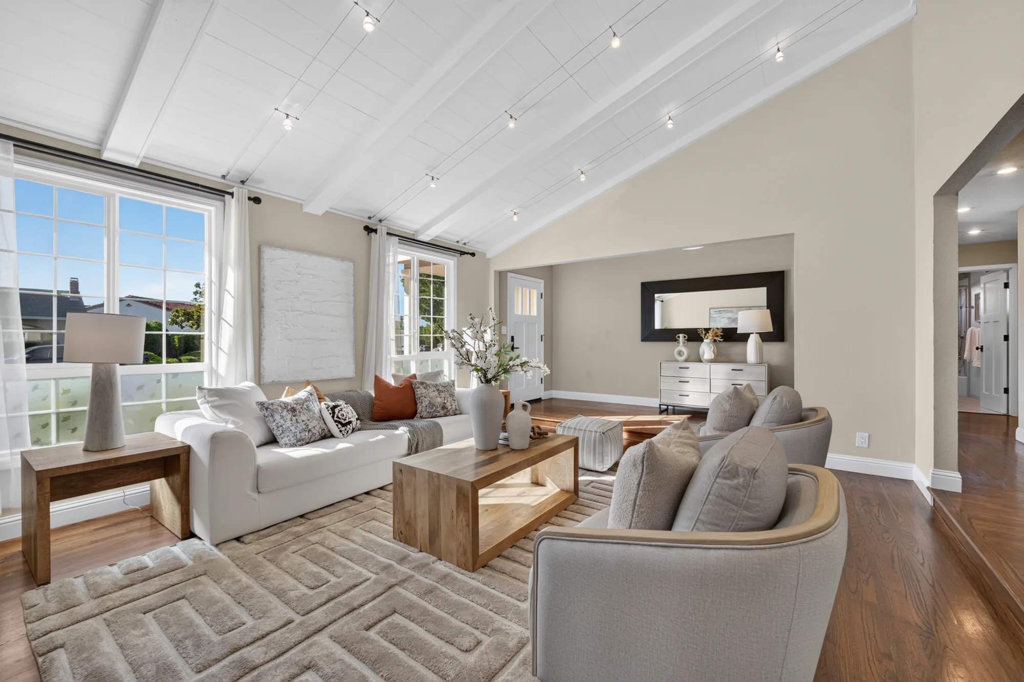Staged living room with vaulted ceiling in the Mountain View home