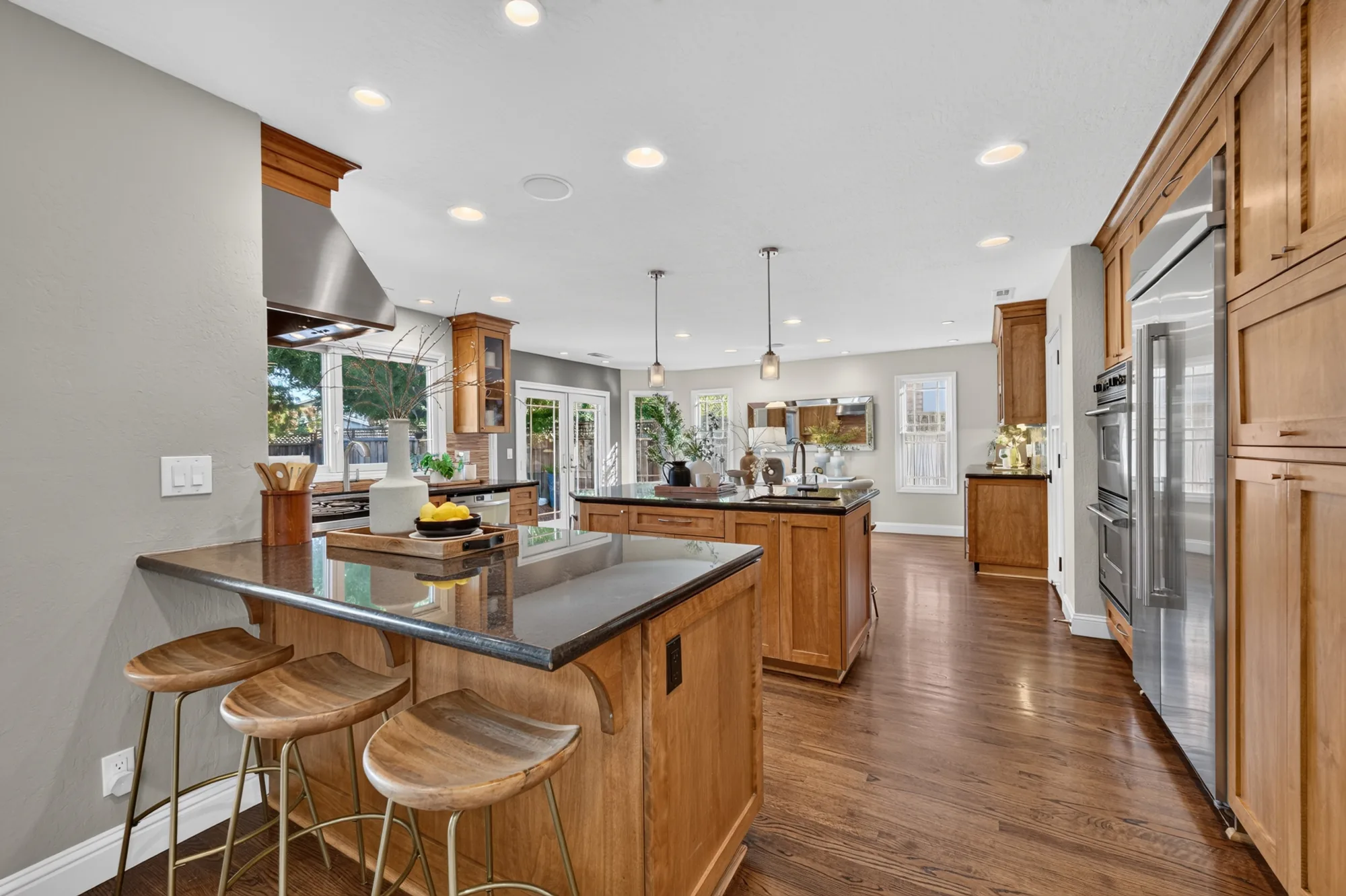 Kitchen with breakfast bar and wood cabinetry