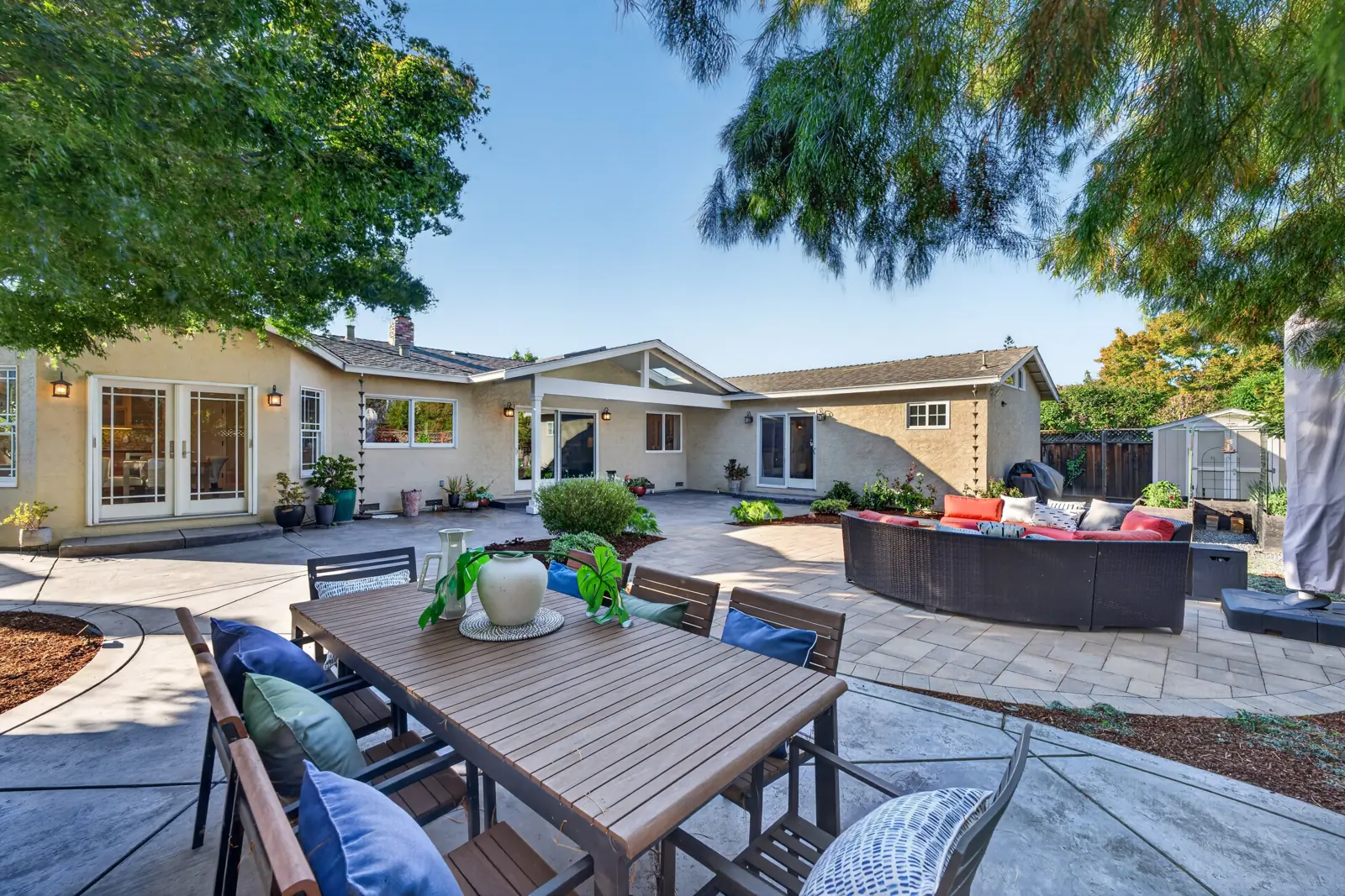 Backyard patio with outdoor dining and lounge seating