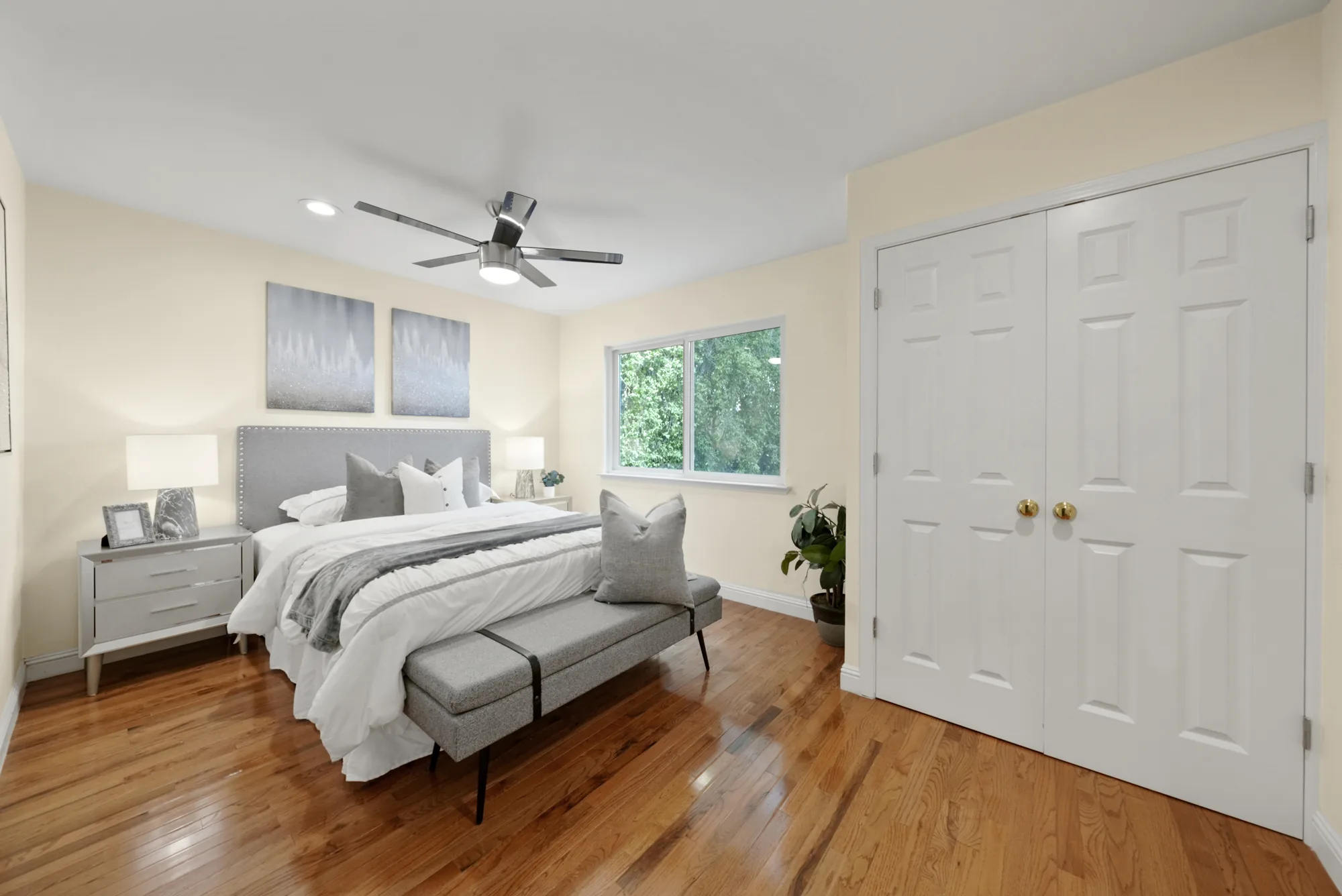 Primary bedroom with vaulted ceiling