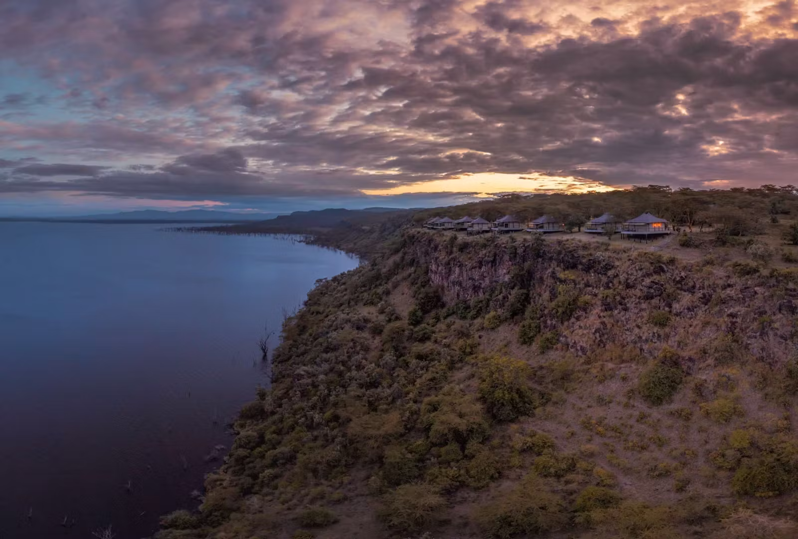 An aerial view of The Cliff, dramatically perched at the edge of a cliff overlooking Lake Nakuru.