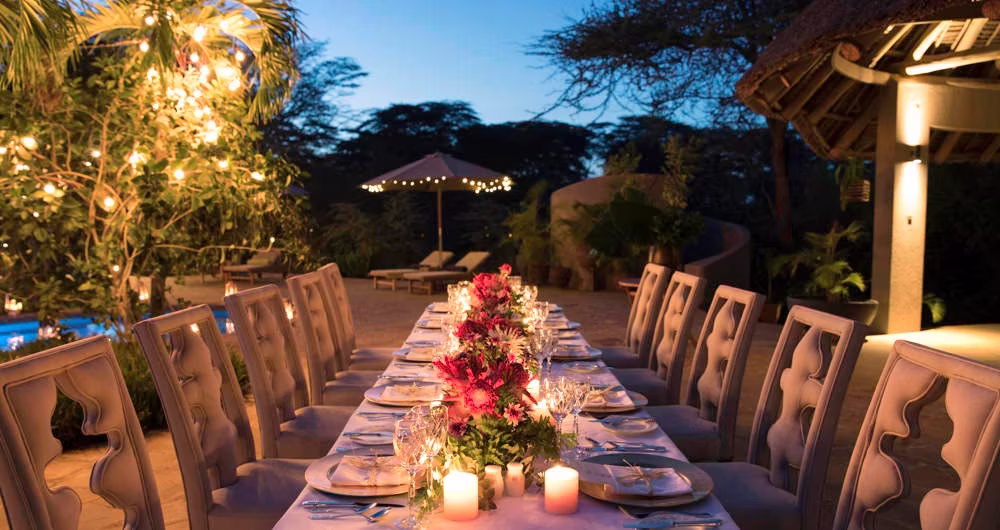 A beautifully set dinner table under the stars at Finch Hattons.
