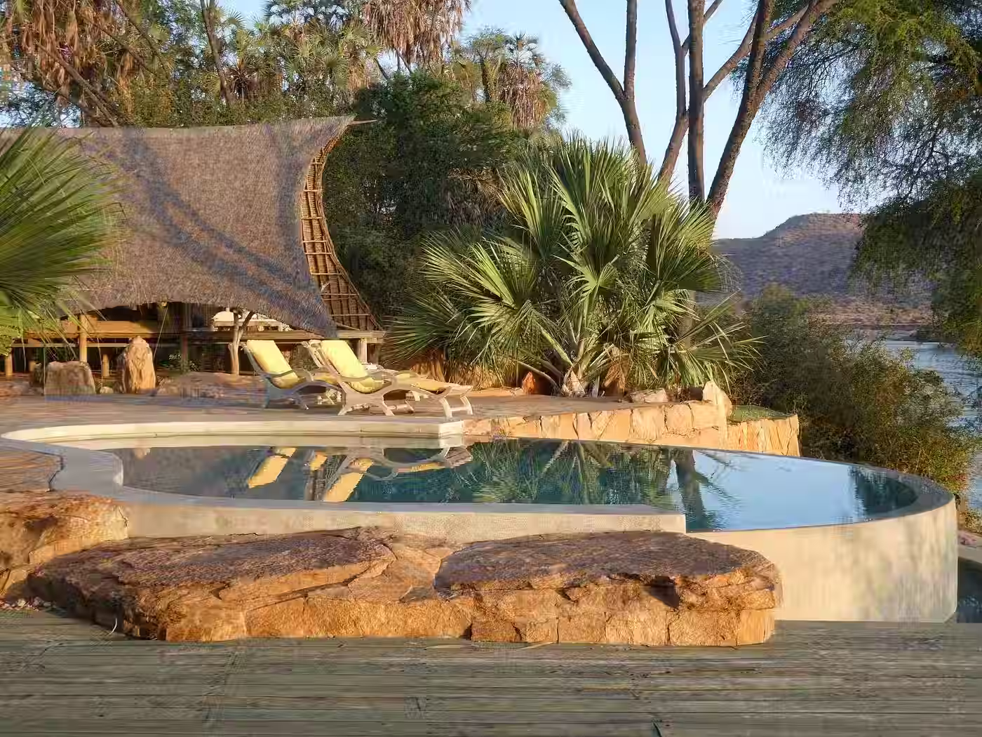 An infinity pool overlooking the vast landscape of Tsavo East.