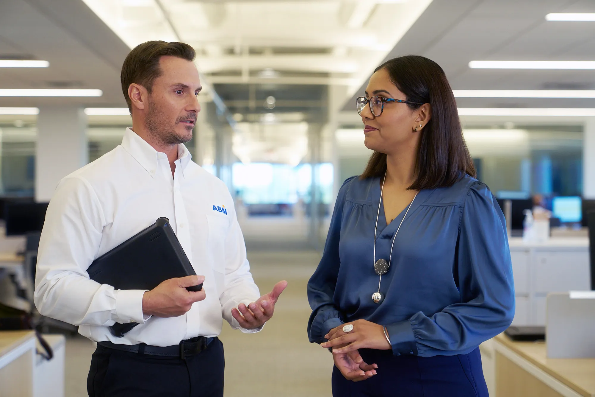 Man and woman in an office having a conversation