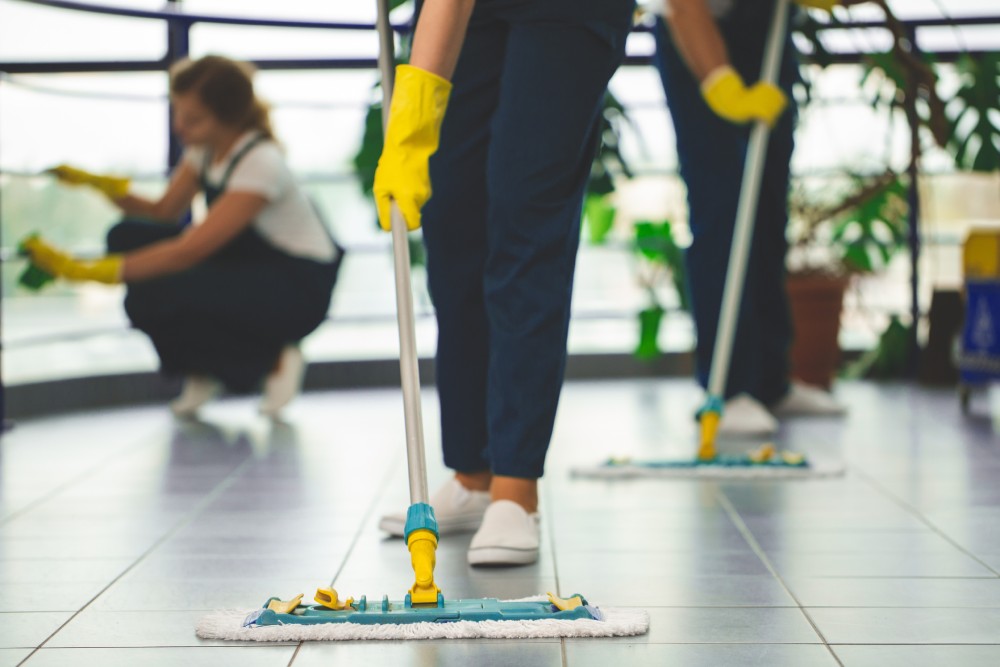 Worker Cleaning Floor