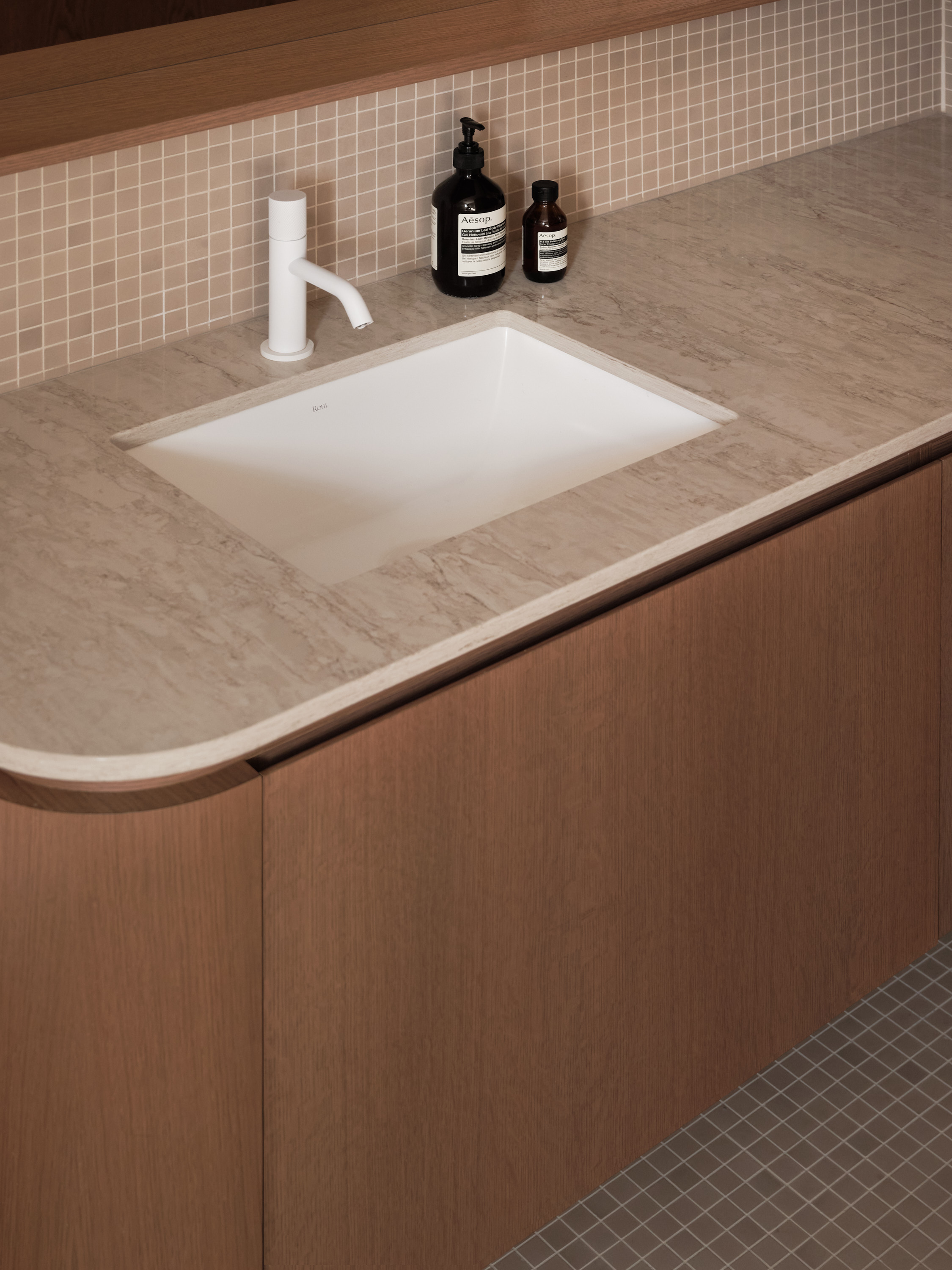 Marble sink with white faucets, guest bathroom