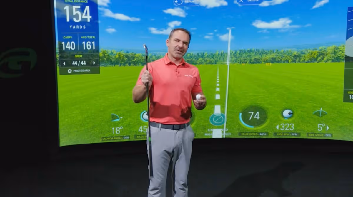 Nick Clearwater giving a online golf lesson at GOLFTEC HQ