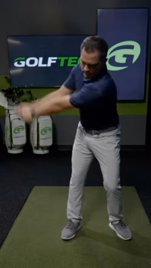 Nick Cross showing a gold drill during an online golf lesson