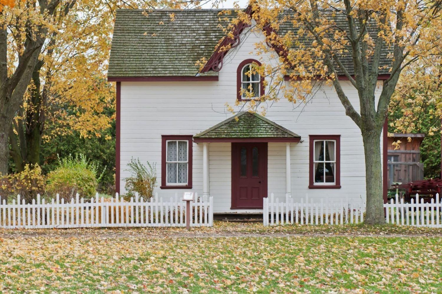 red and white house in a small town
