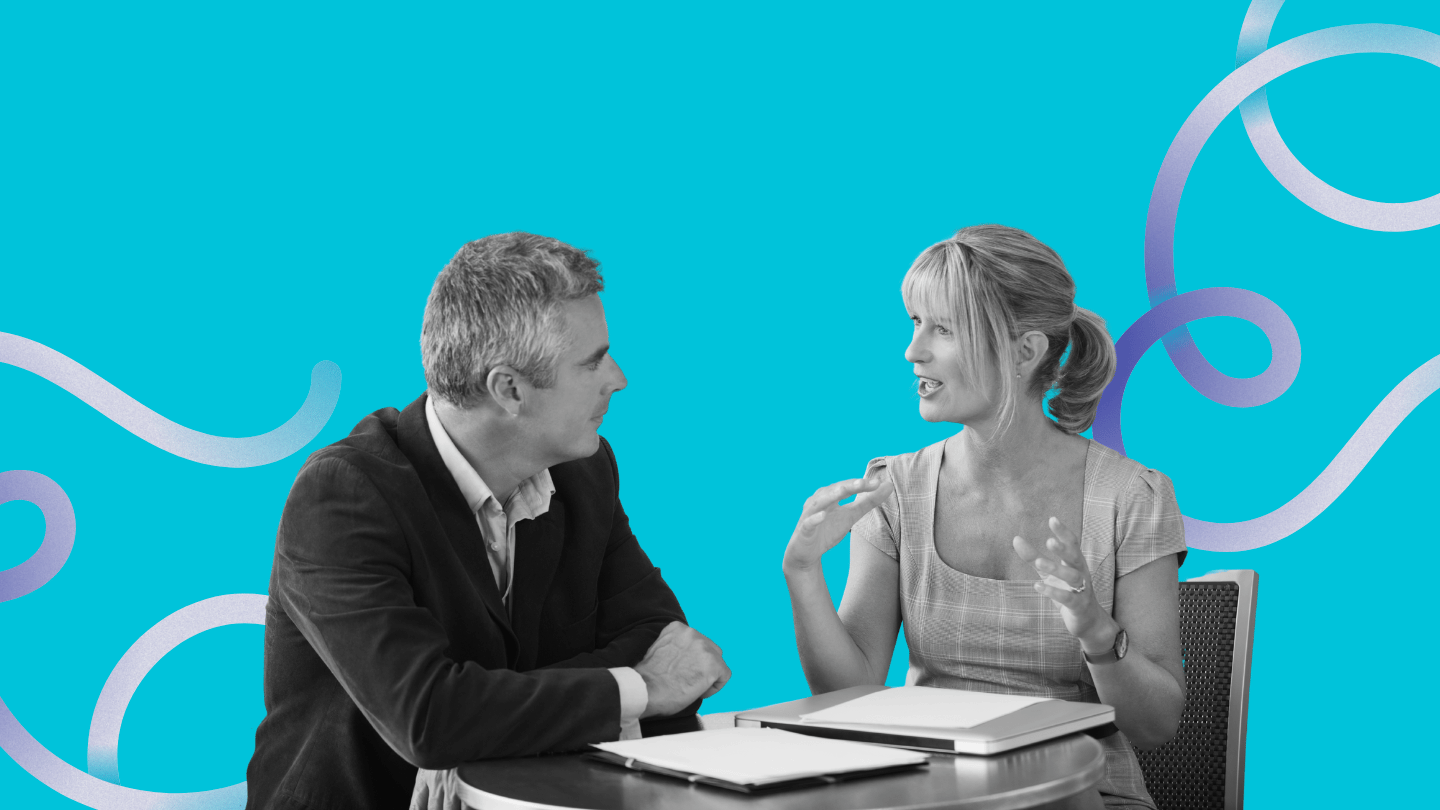 two professionals have one on one meeting
