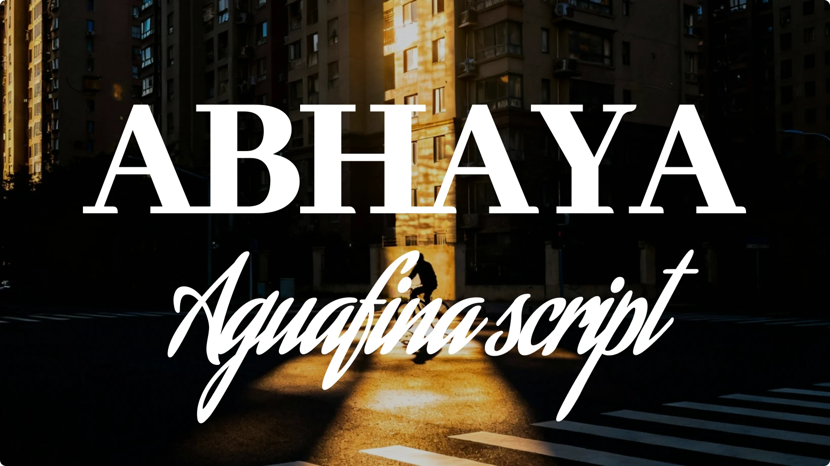 Example of font pairing using Abhaya and Aquafina Script displayed over a city street with warm sunlight, showing contrast between a strong modern serif and an elegant cursive font.