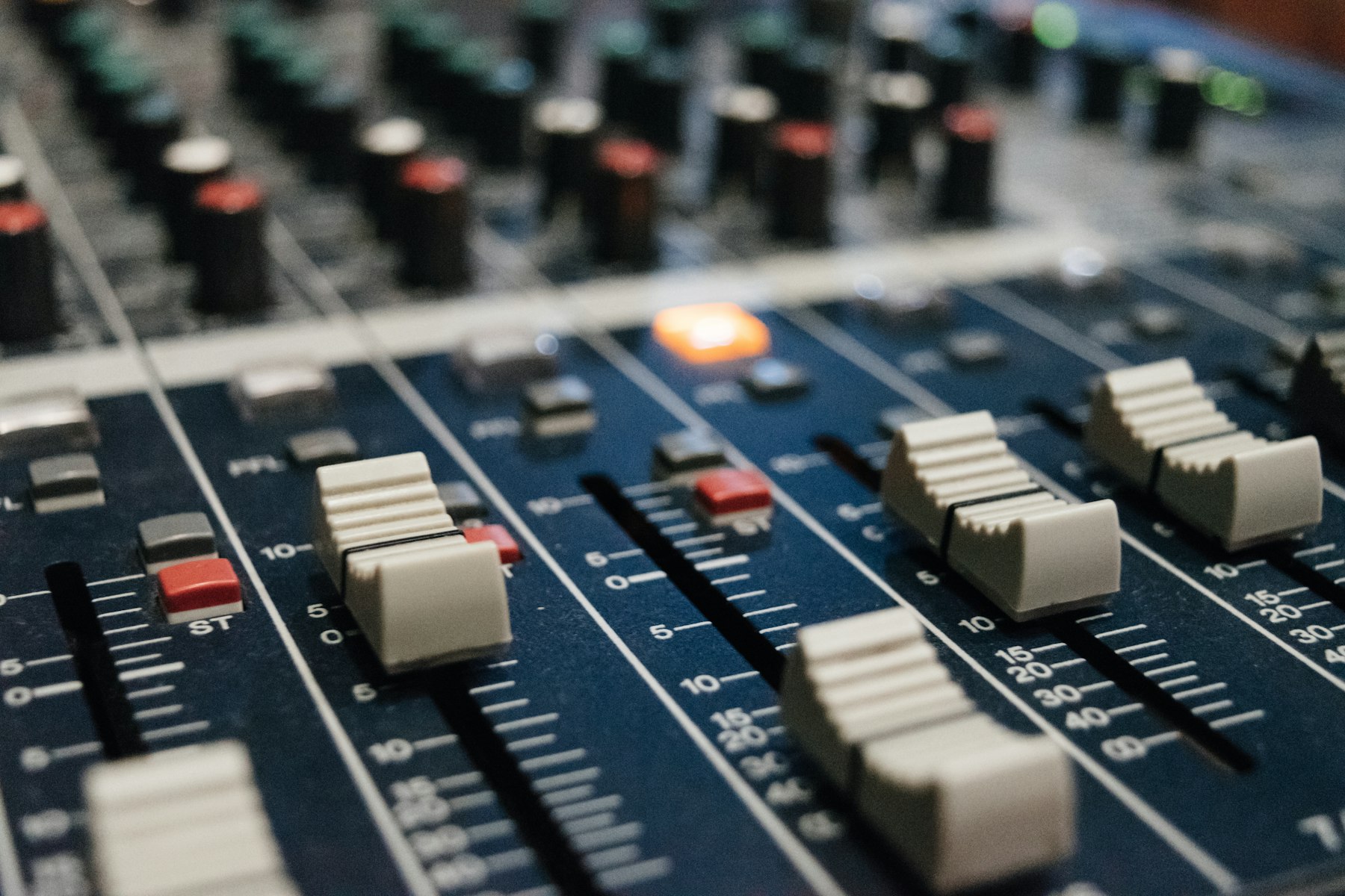 Close-up of the faders on a sound mixing console