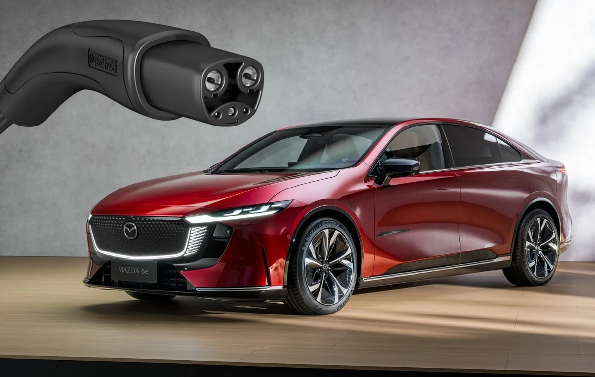 Electric Mazda 6e next to NACS connector