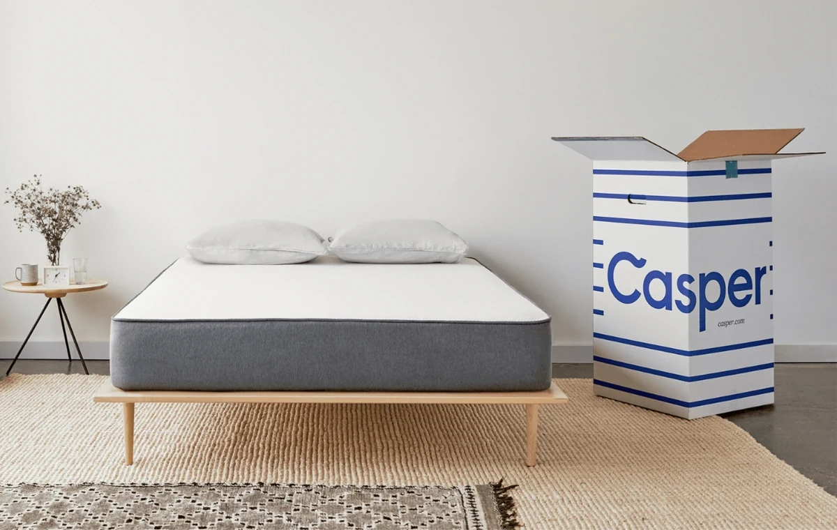 Casper Mattress Box next to a bed