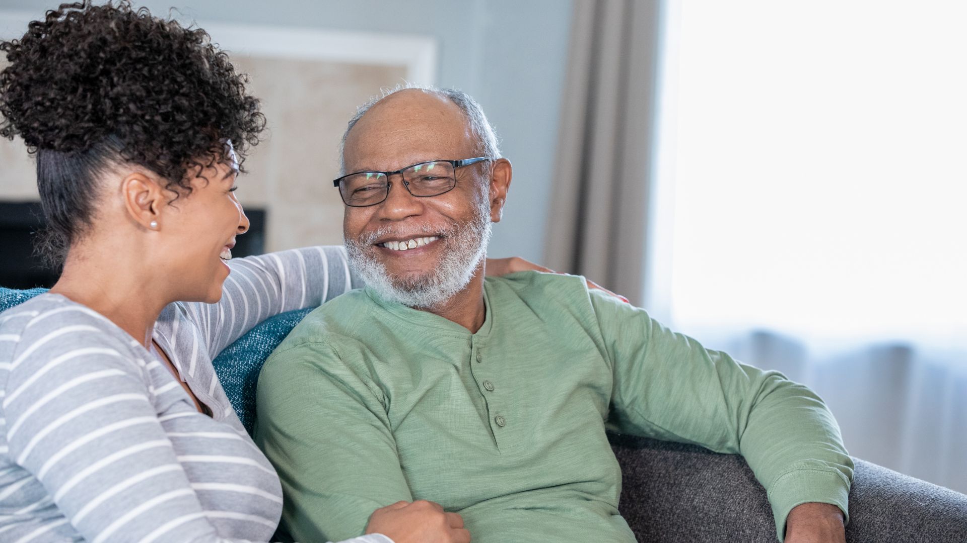A senior man and his daughter talk about his senior living options. 