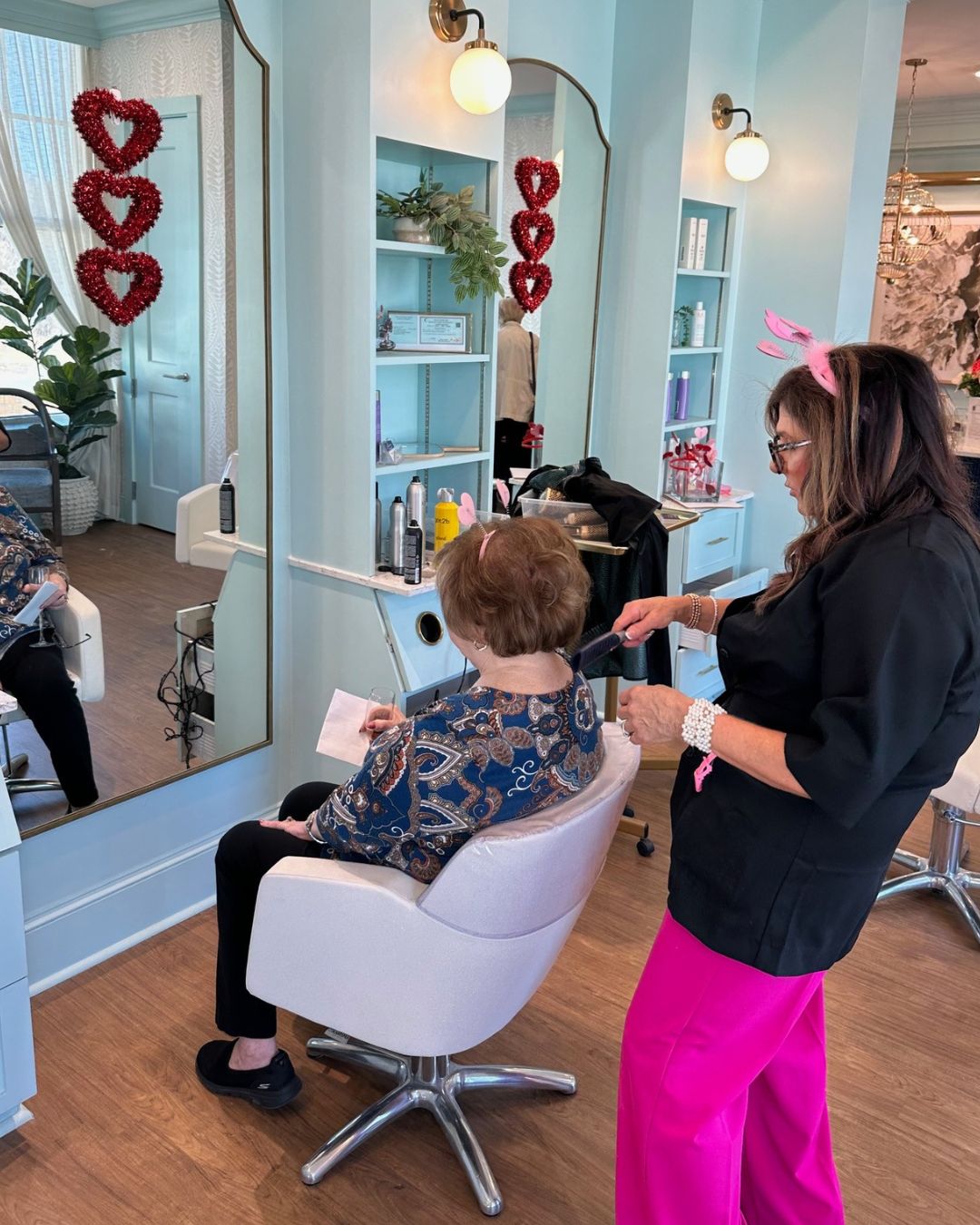 A Symphony Park resident gets pampered in the salon at the Galentine's Day soiree.