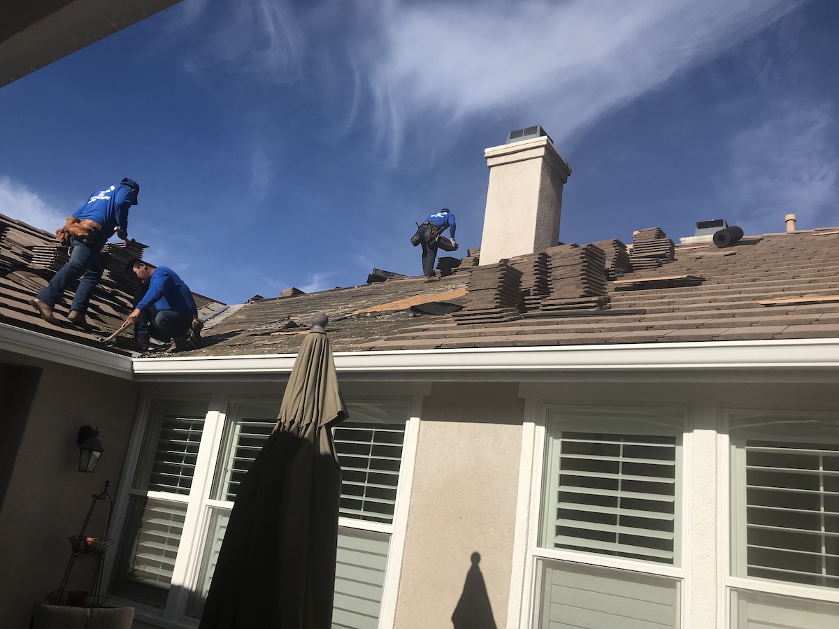 Asphalt vs Tile Roof Replacement