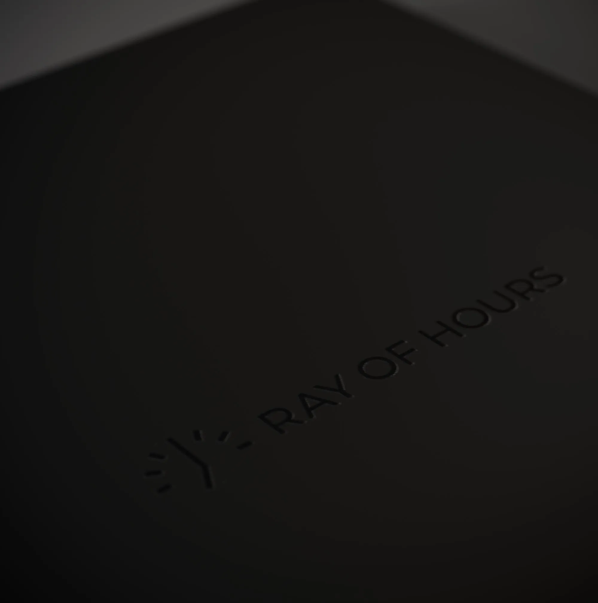 Black logo on a black box