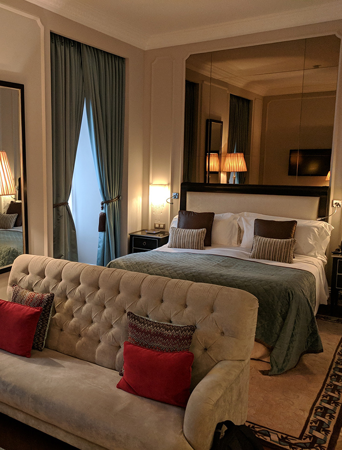 bedroom with bed side and ceiling lamps