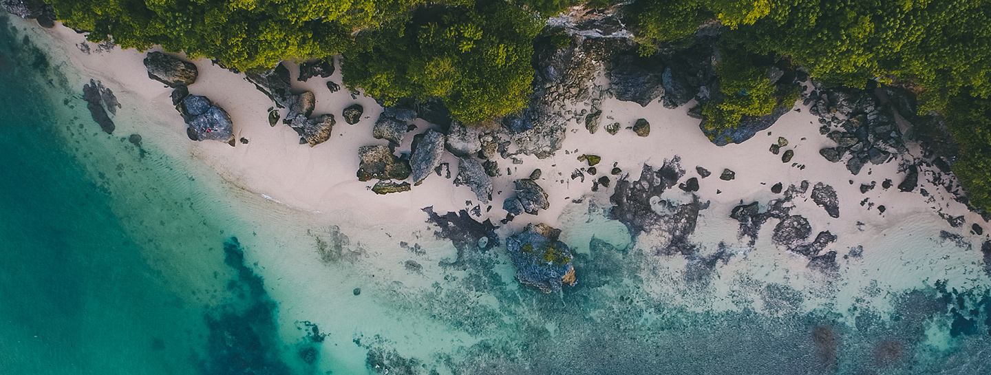 blue ocean with white sands