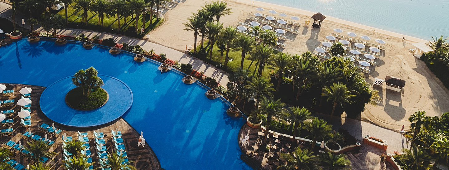 blue ocean with white sands