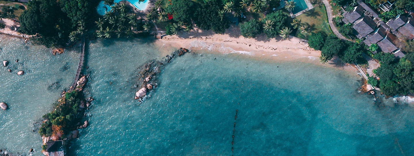 blue ocean with white sands