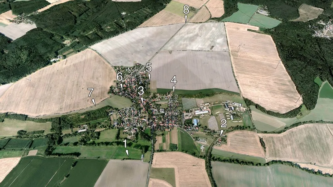 a view of a large field with a lot of trees and a lot of buildings