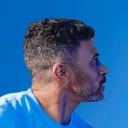 Side view of male with blue background