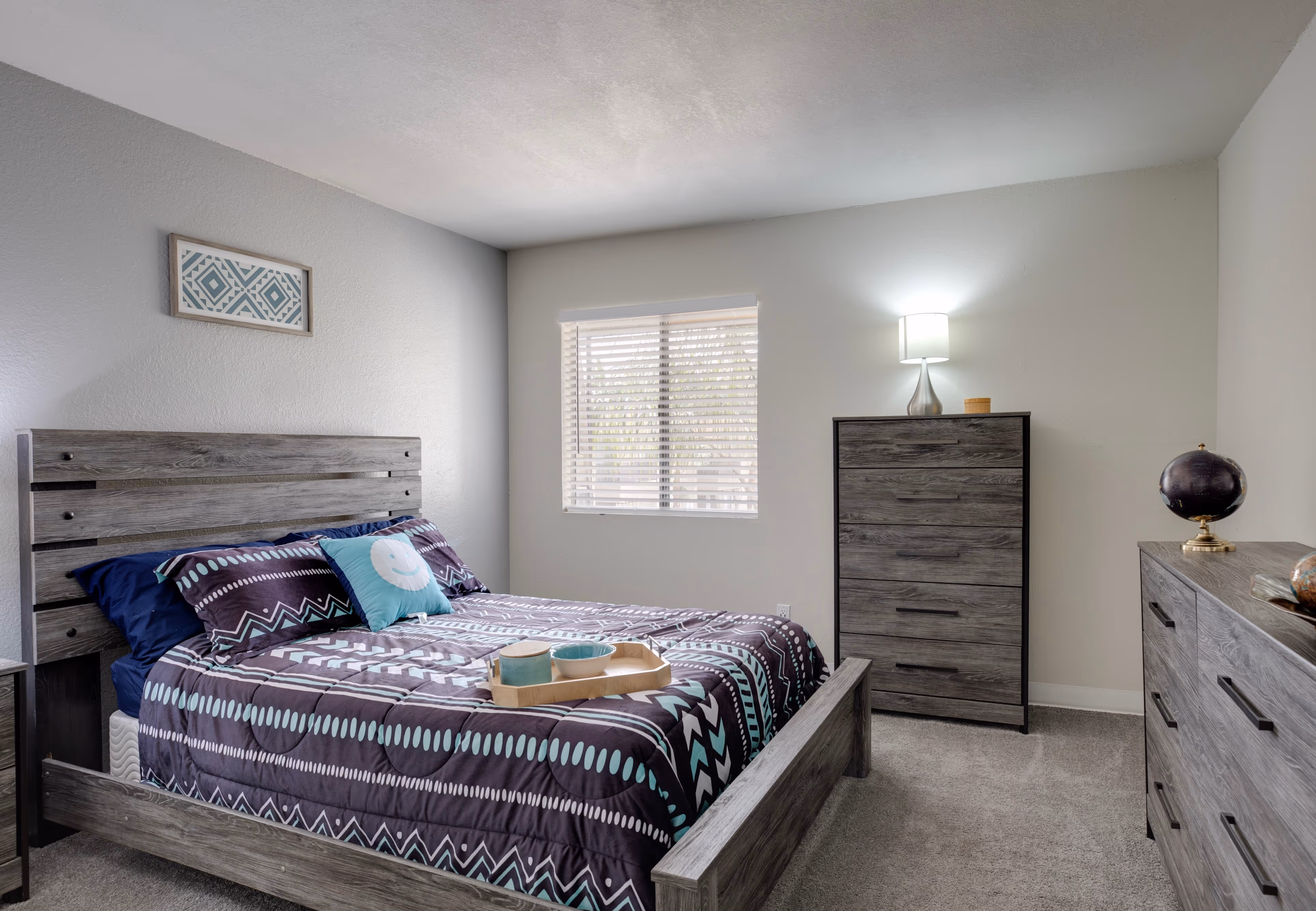 Bedroom with blue bedspread on bed