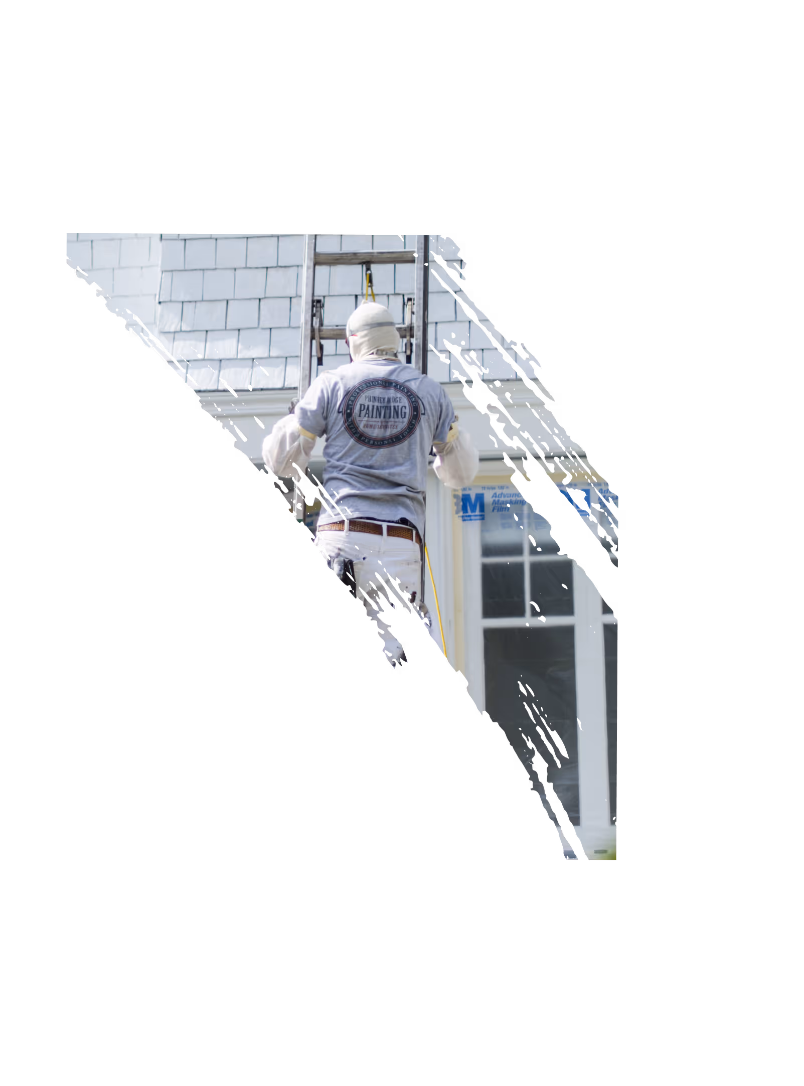 Painter wearing a gray shirt with a painting service logo climbing a ladder next to a house with gray shingles.