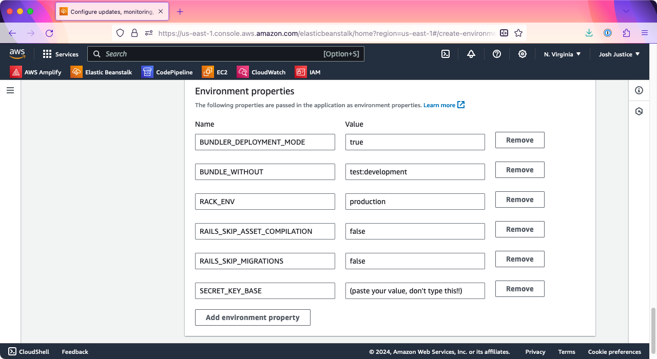 The 'Environment properties' section of the Elastic Beanstalk application creation wizard. A SECRET_KEY_BASE property has been added.