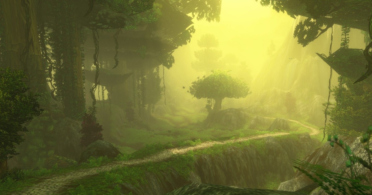 A sunlit forest path winds through a lush green landscape in World of Warcraft, surrounded by towering trees, vines, rocky cliffs, and golden mist.