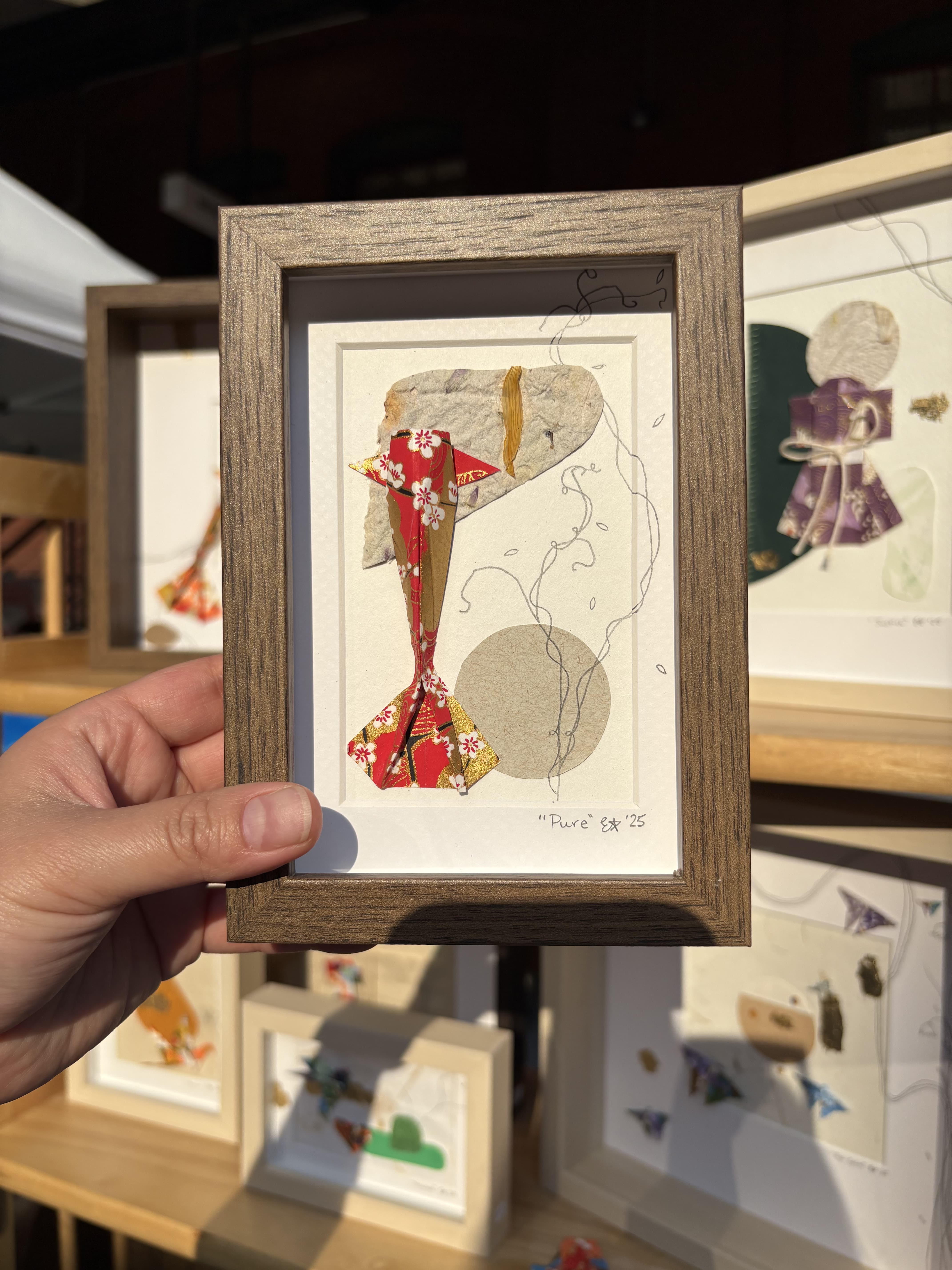 Origami koi in a shadowbox