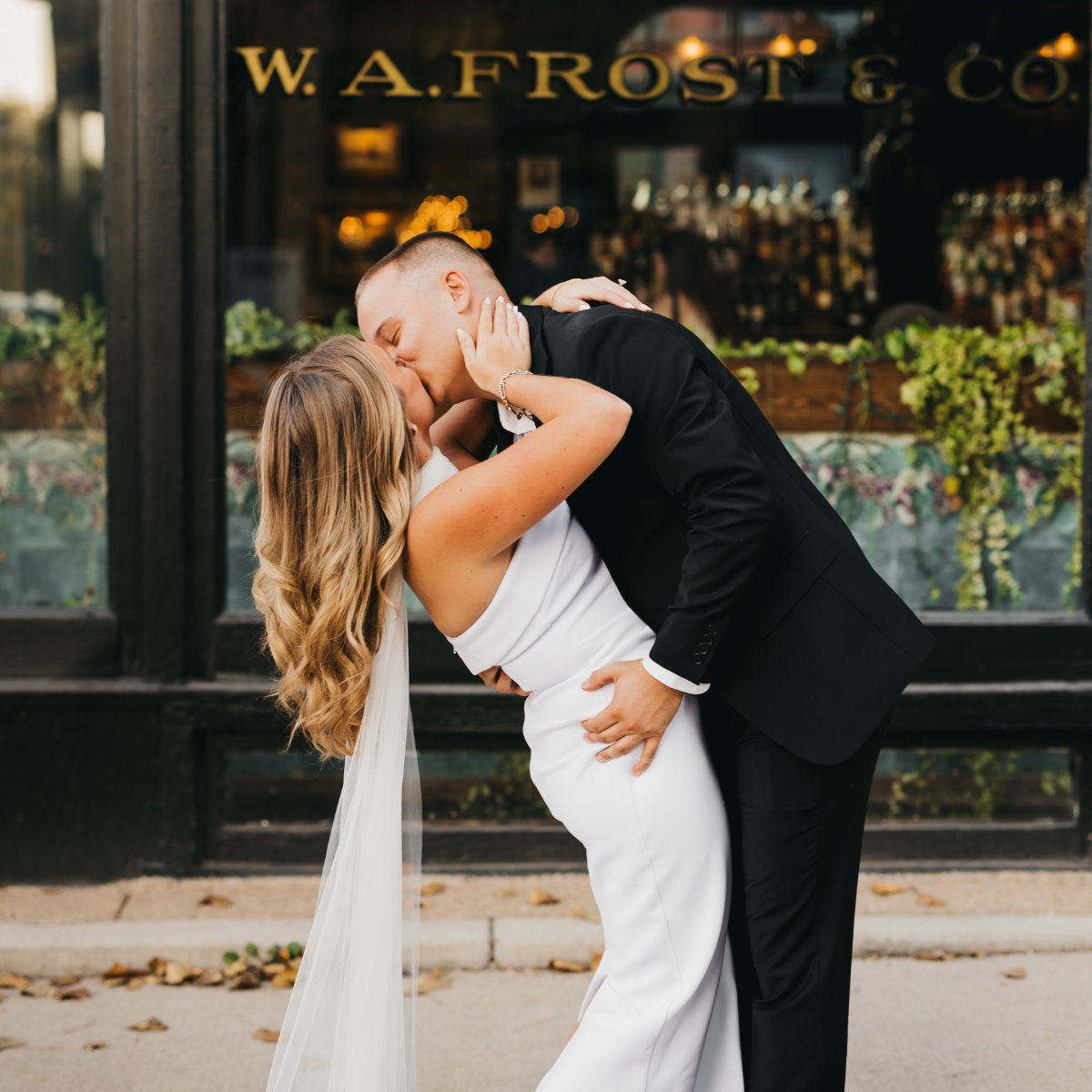 Couple kissing outside WA Frost