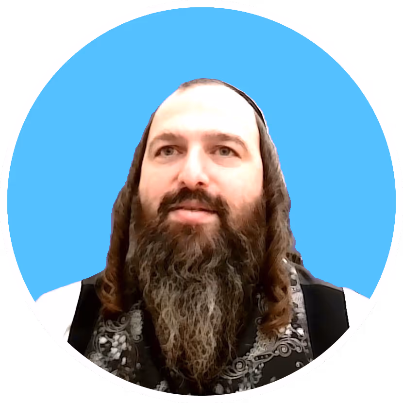 Bearded man with curly hair wearing a patterned vest against a blue circular background.
