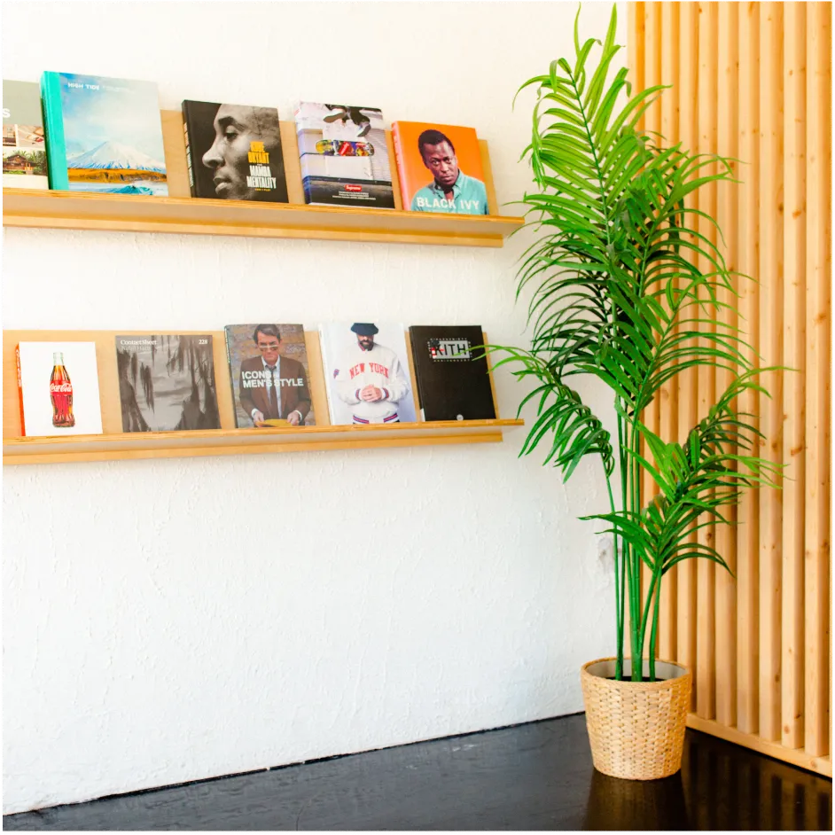 Interior view of wall-mounted shelves and seating area inside a modern barbershop studio in Lakeland, FL